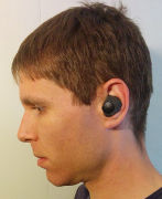 Side view of my head wearing the assembled Here One earpiece.