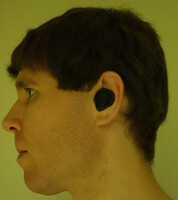 Side view of my head wearing the assembled IQbuds2 MAX earpiece.